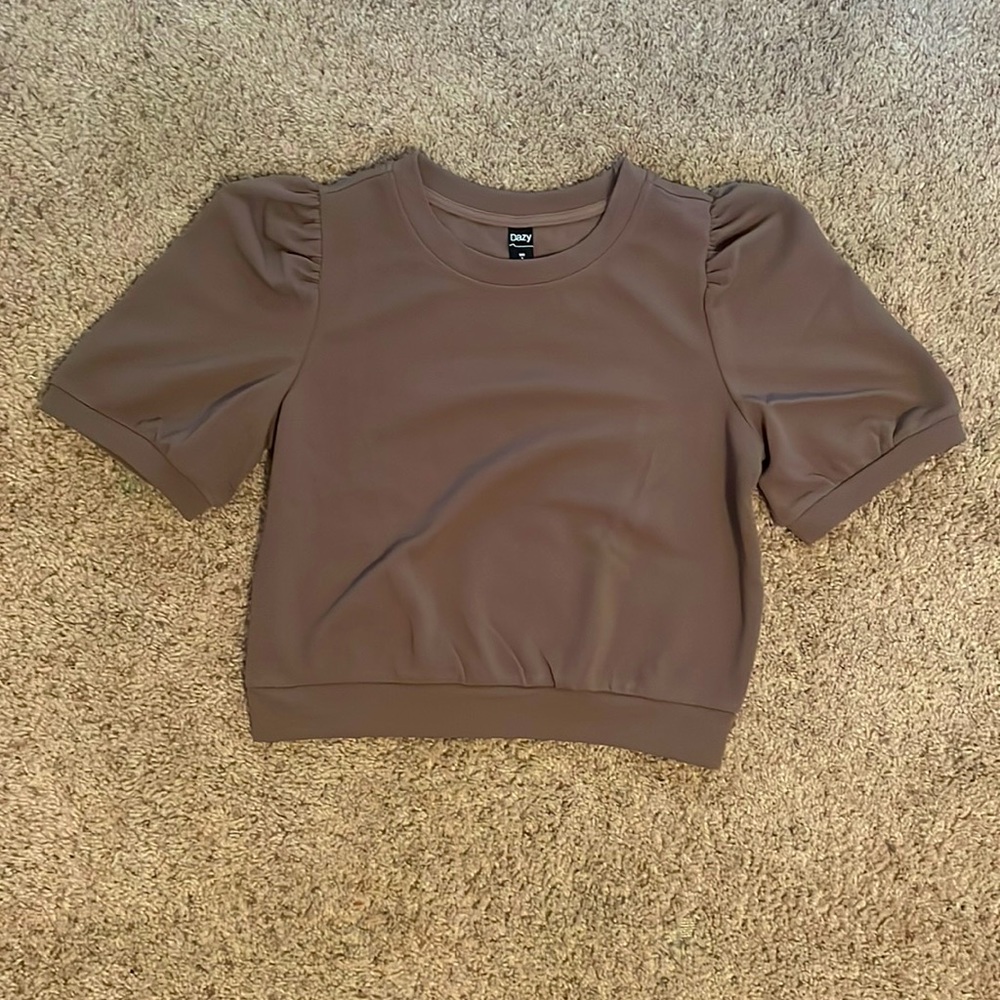 This beautiful blouse brown top is sure to make a statement!